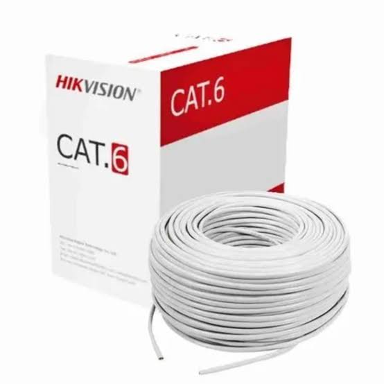White cable coil beside Hikvision CAT6 packaging