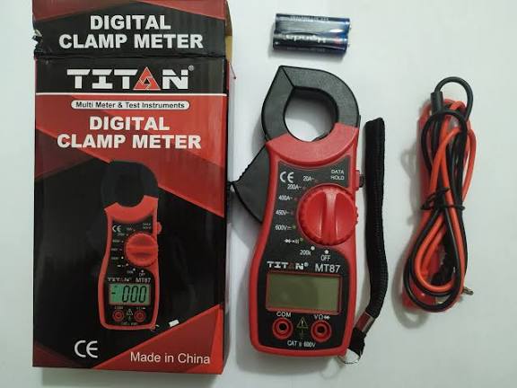 TITAN MT87 digital clamp meter retail box with the meter, test leads, and a 9V battery, Made in China