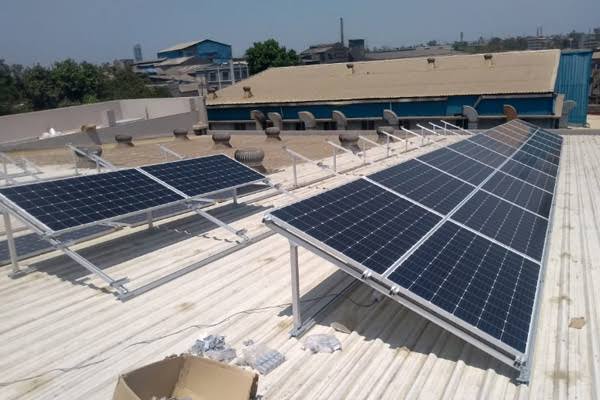 Solar panels installed on a flat urban rooftop