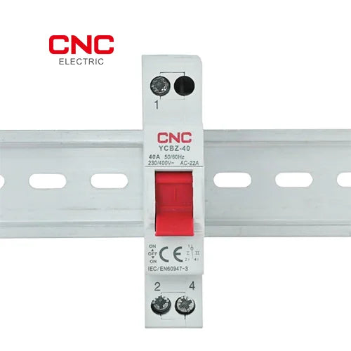 CNC YCBZ-40 isolator switch snapped onto a DIN rail, showing the label and red handle
